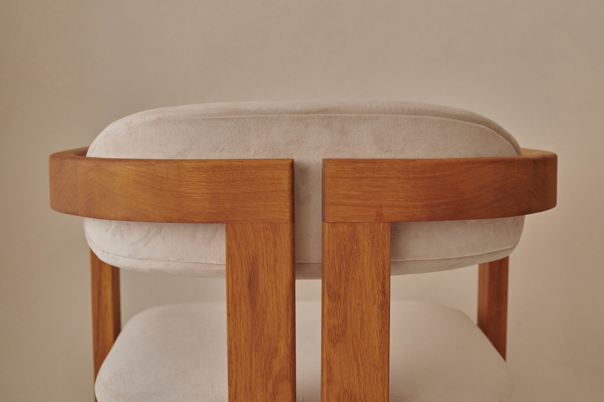 Aime Té Tribute dining chair with black frame and off-white upholstered seat, modern design for elegant dining spaces.