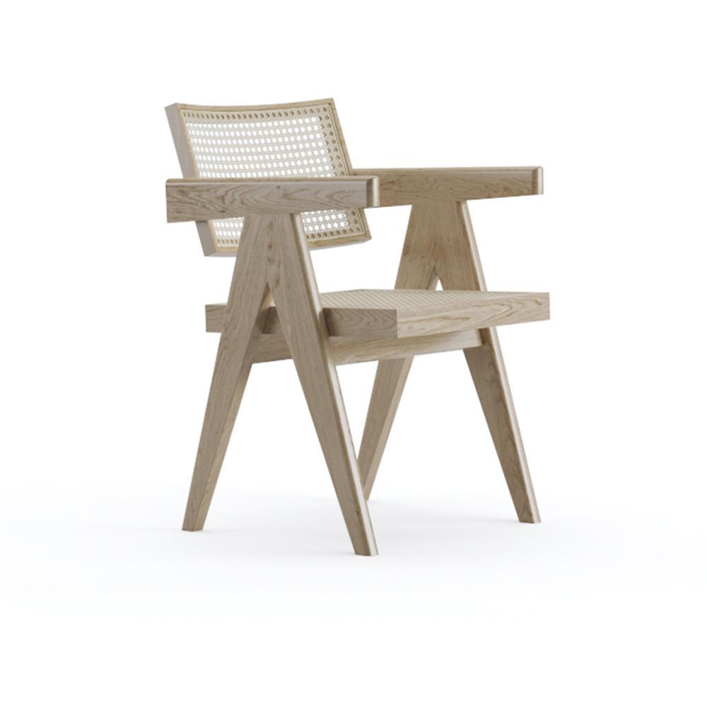 Rattan Pierre dining chair by Aime Té with natural finish, showcasing woven rattan seat and elegant curved design.