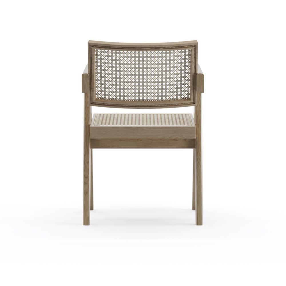 Natural rattan dining chair called Pierre by Aime Té, showcasing woven rattan seat and backrest with a sleek, modern design.