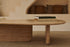 Form coffee table made of travertine with sleek, rectangular design and natural stone surface.