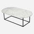 Glossy oval marble coffee table with Bianco Carrara white surface and sleek design, perfect for modern living rooms.