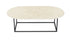 Oval marble coffee table in Crema Marfil beige with a glossy finish, featuring a sleek modern design.