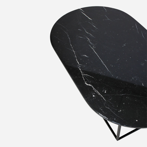 Glossy oval marble coffee table in Nero Marquina black with sleek design, perfect for modern living rooms.