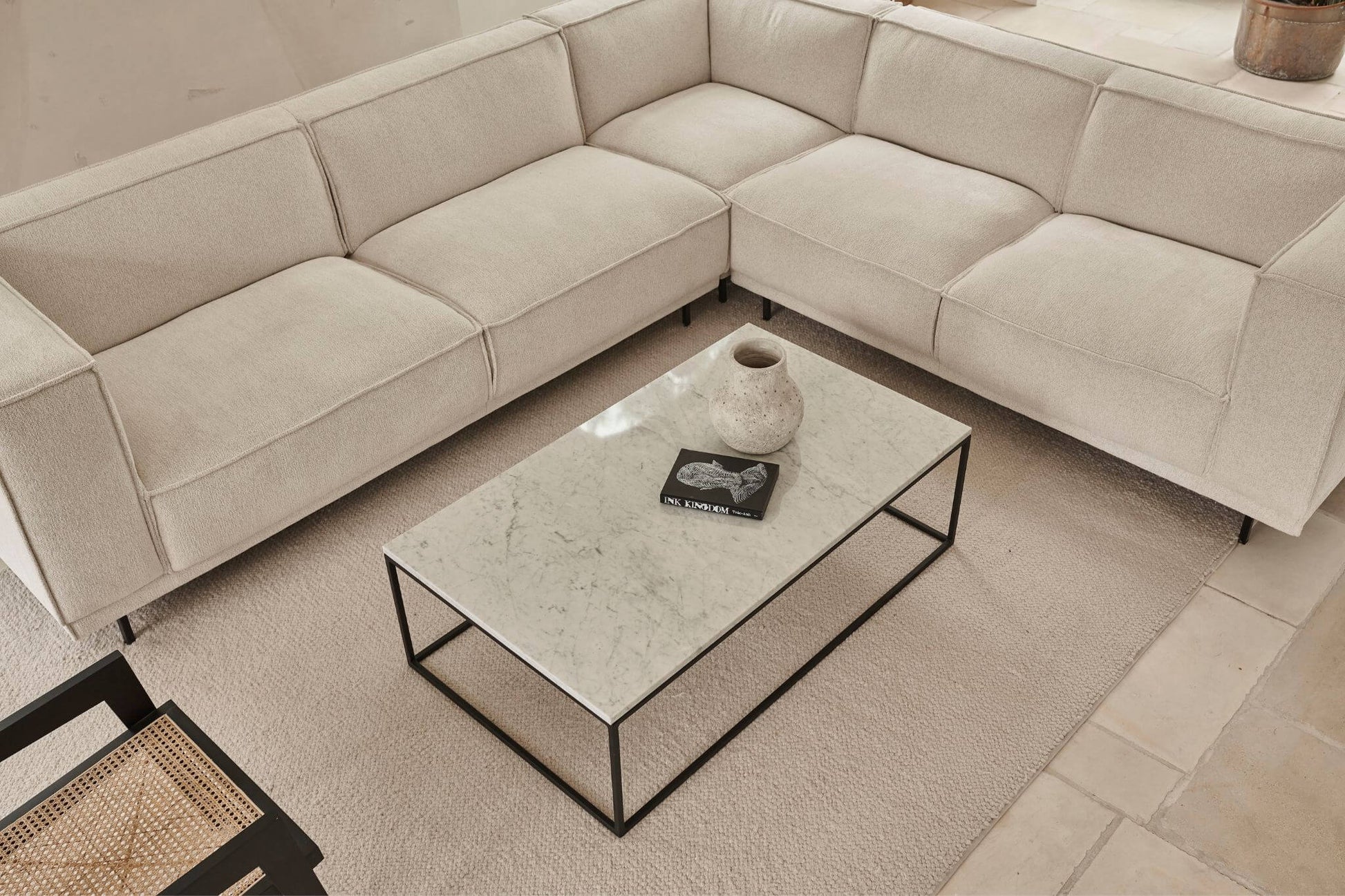 Rectangular marble coffee table made of travertine with a sleek natural stone surface and modern design.