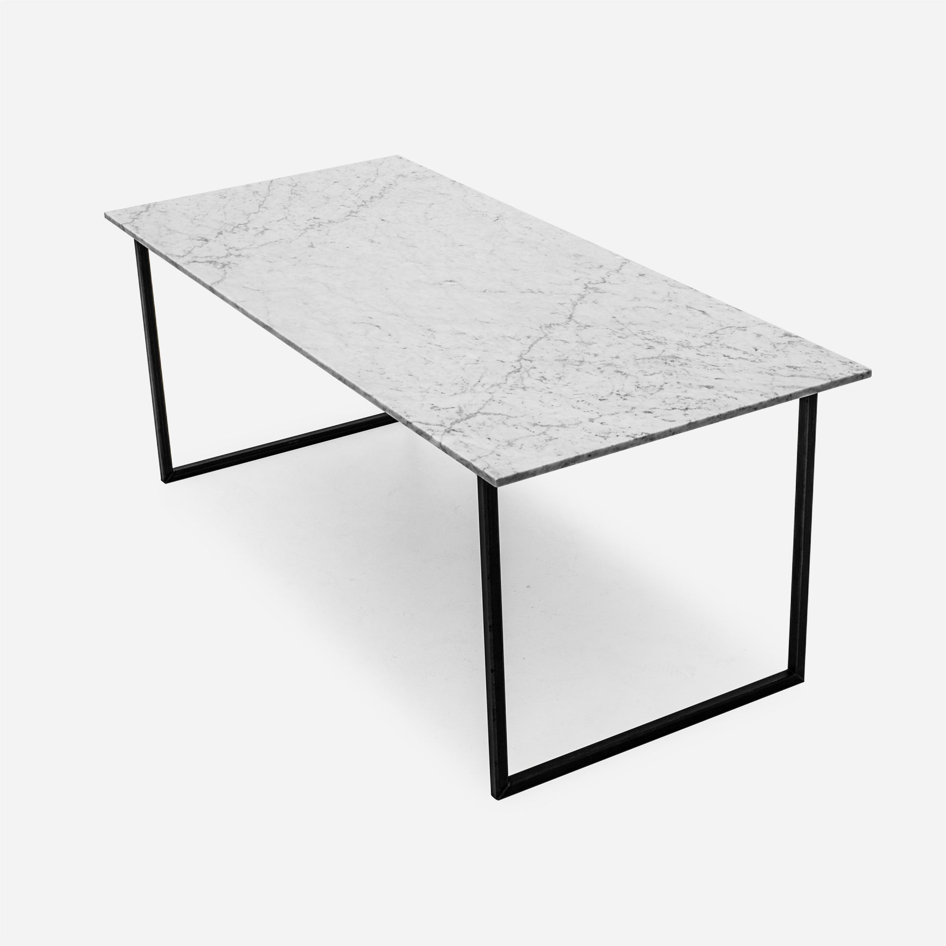 Rectangular Bianco Carrara white marble dining table with U-shaped frame, glossy finish, measuring 140 x 80 cm.