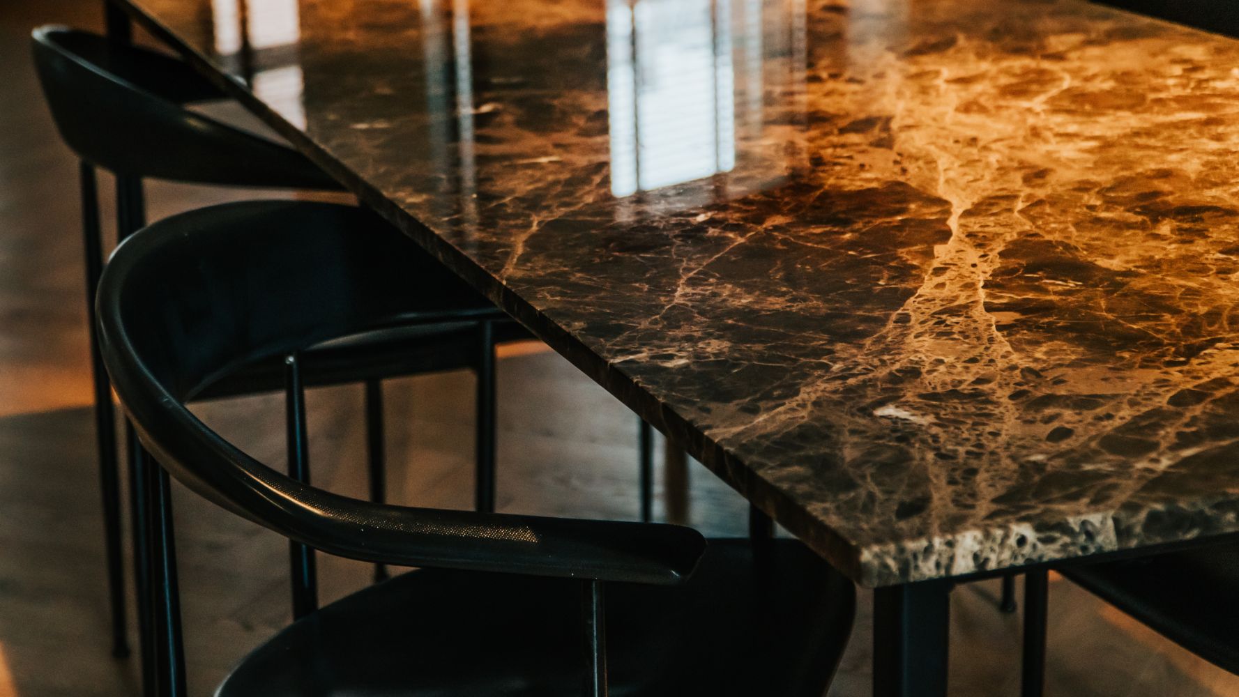 Dark Emperador Brown marble rectangular dining table with glossy finish and U-frame design, ideal for modern dining rooms.
