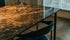 Dark Emperador brown rectangular marble dining table with glossy finish and U-frame design, ideal for modern dining spaces.