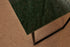 Glossy rectangular marble dining table in India Green with four legs, ideal for modern dining spaces.