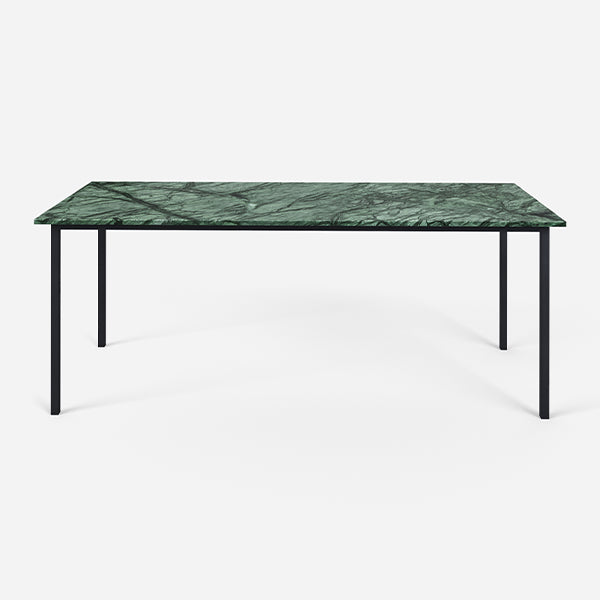Glossy rectangular marble dining table in India Green with four legs, ideal for modern dining spaces.