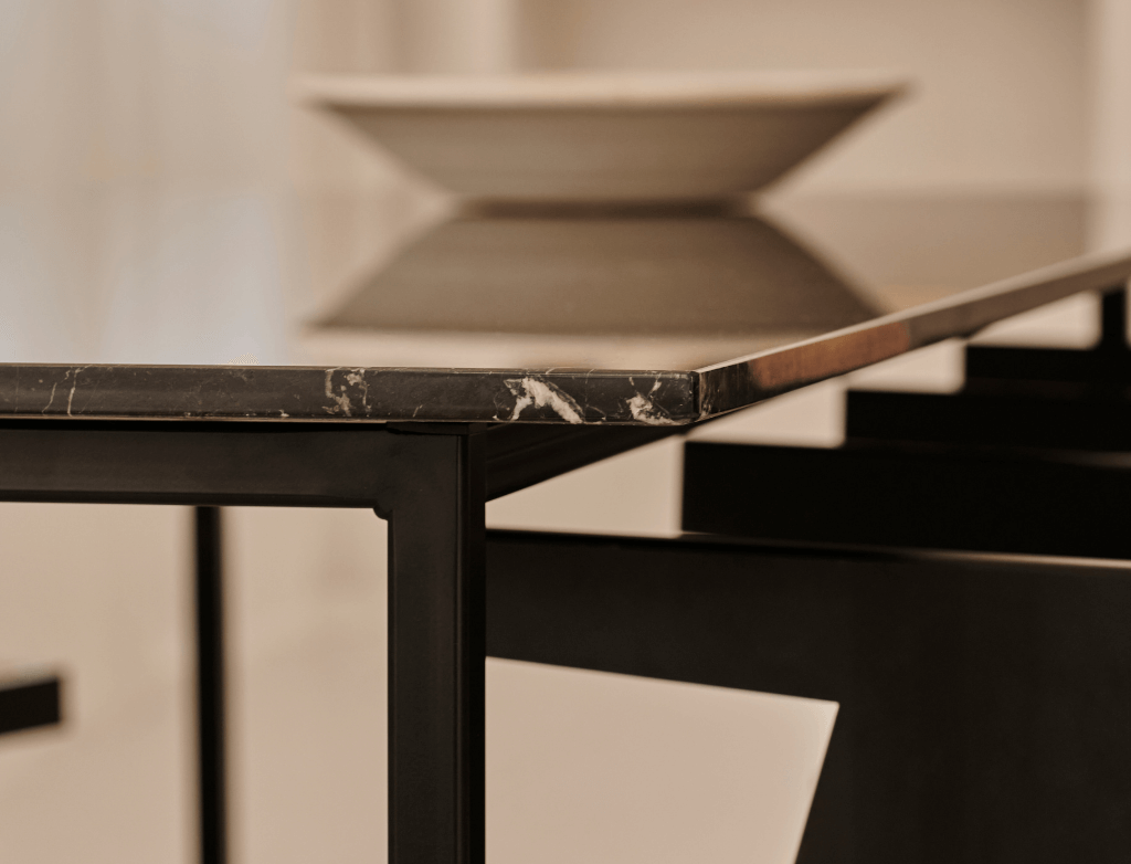 Rectangular Nero Marquina black marble dining table with four legs, glossy finish, ideal for modern dining rooms.