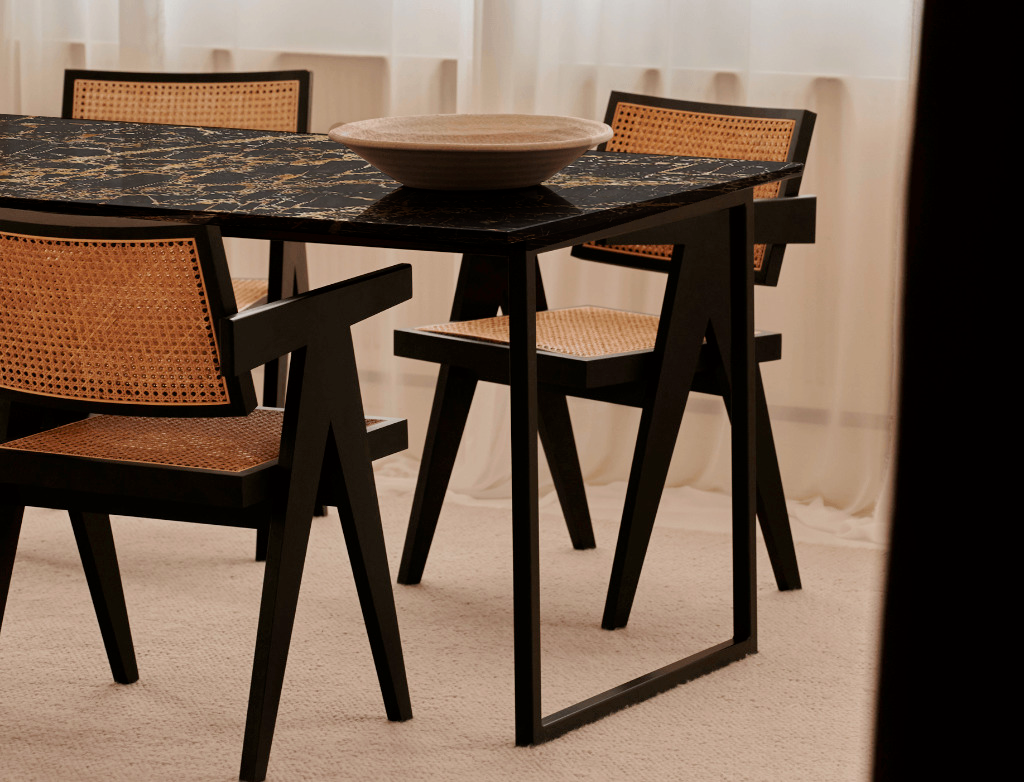 Rectangular Portoro marble dining table with glossy finish and U-shaped metal frame, ideal for modern dining rooms.