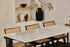 Rectangular Bianco Carrara white marble dining table with four legs, matte dent in the middle, ideal for modern dining rooms