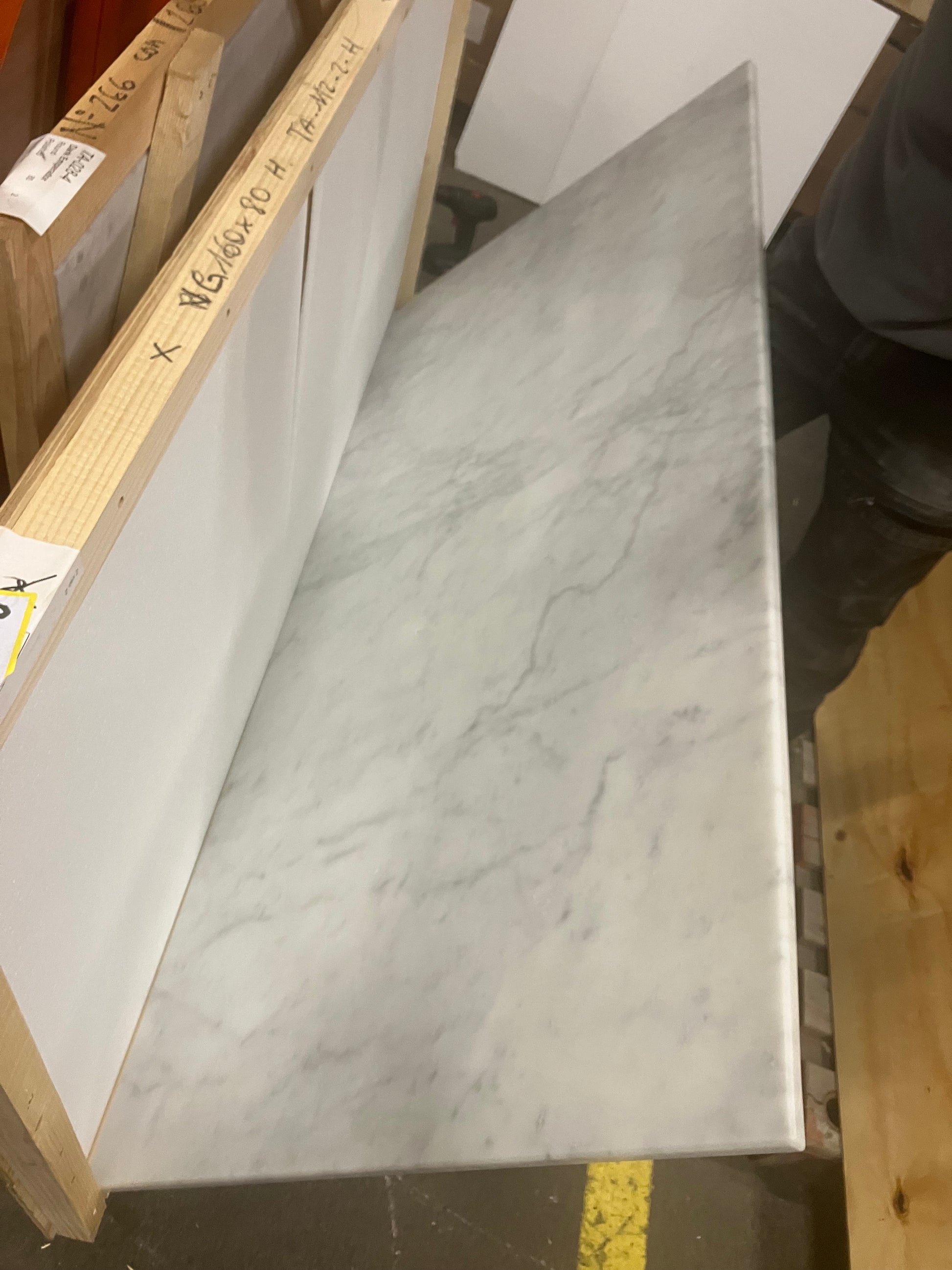 Rectangular marble dining table with Bianco Carrara white surface and four legs, matte finish, perfect for modern dining rooms.