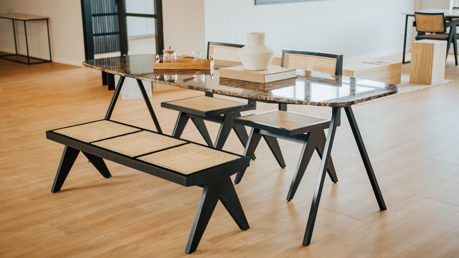 Celio marble dining table by My Store with dark Emperador brown marble top and V-frame design, glossy finish.