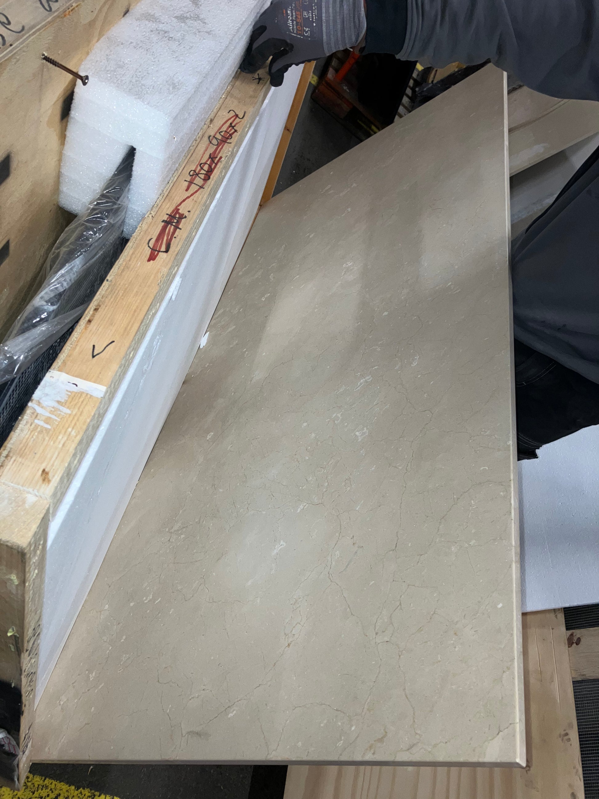Rectangular marble dining table with beige Crema Marfil surface and wooden frame, 180x90 cm, glossy finish, good condition.