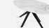 Oval Bianco Carrara marble dining table with glossy finish and arch metal frame, modern design for elegant dining rooms.