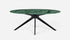 Glossy oval marble dining table with India Green marble top and arch-shaped legs, showcasing a stylish modern design.