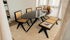 Glossy oval Nero Marquina marble dining table with arch black metal frame, stylish and modern for contemporary dining rooms.