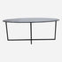 Glossy black Nero Marquina marble oval dining table with cross-frame design, perfect for modern dining spaces.