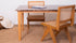 Rectangular marble dining table with dark Emperador brown finish and wooden frame, ideal for modern dining rooms.