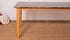 Rectangular marble dining table with dark Emperador brown marble surface and wooden frame, perfect for modern dining rooms.