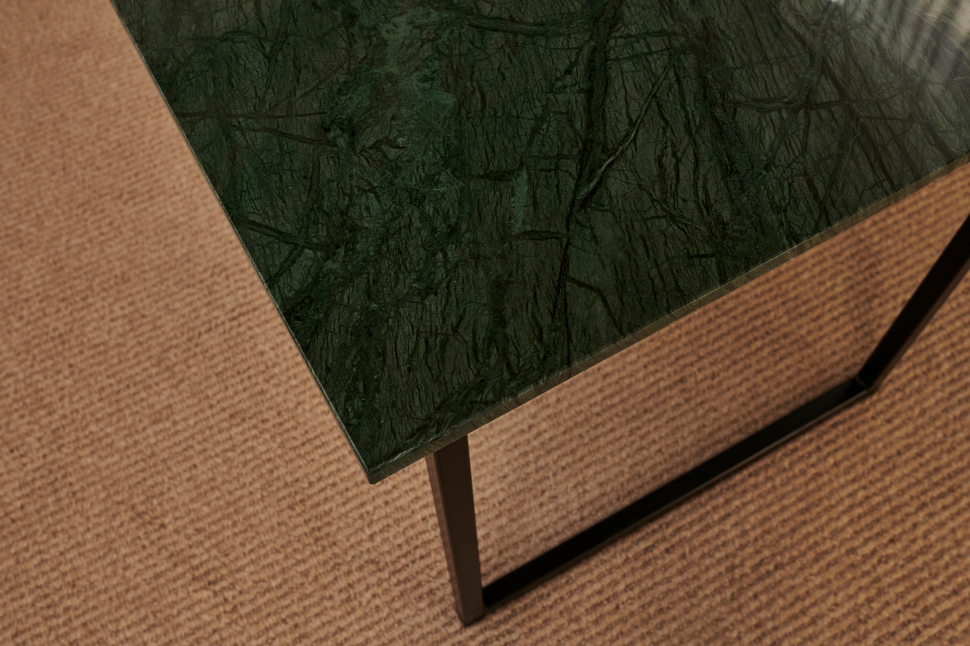 Glossy rectangular marble dining table with India Green marble top and wooden frame, ideal for modern dining rooms.