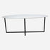 Oval Bianco Carrara marble dining table with cross-frame base, matte grey finish, showing small scratches, size 160x100 cm.