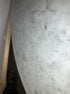 Oval Bianco Carrara marble dining table with cross-frame, matte grey tint, small scratches, 160x100cm, from My Store.