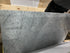 Rectangular marble dining table in Bianco Carrara White with four legs, matte finish, minor scratches visible in the image.