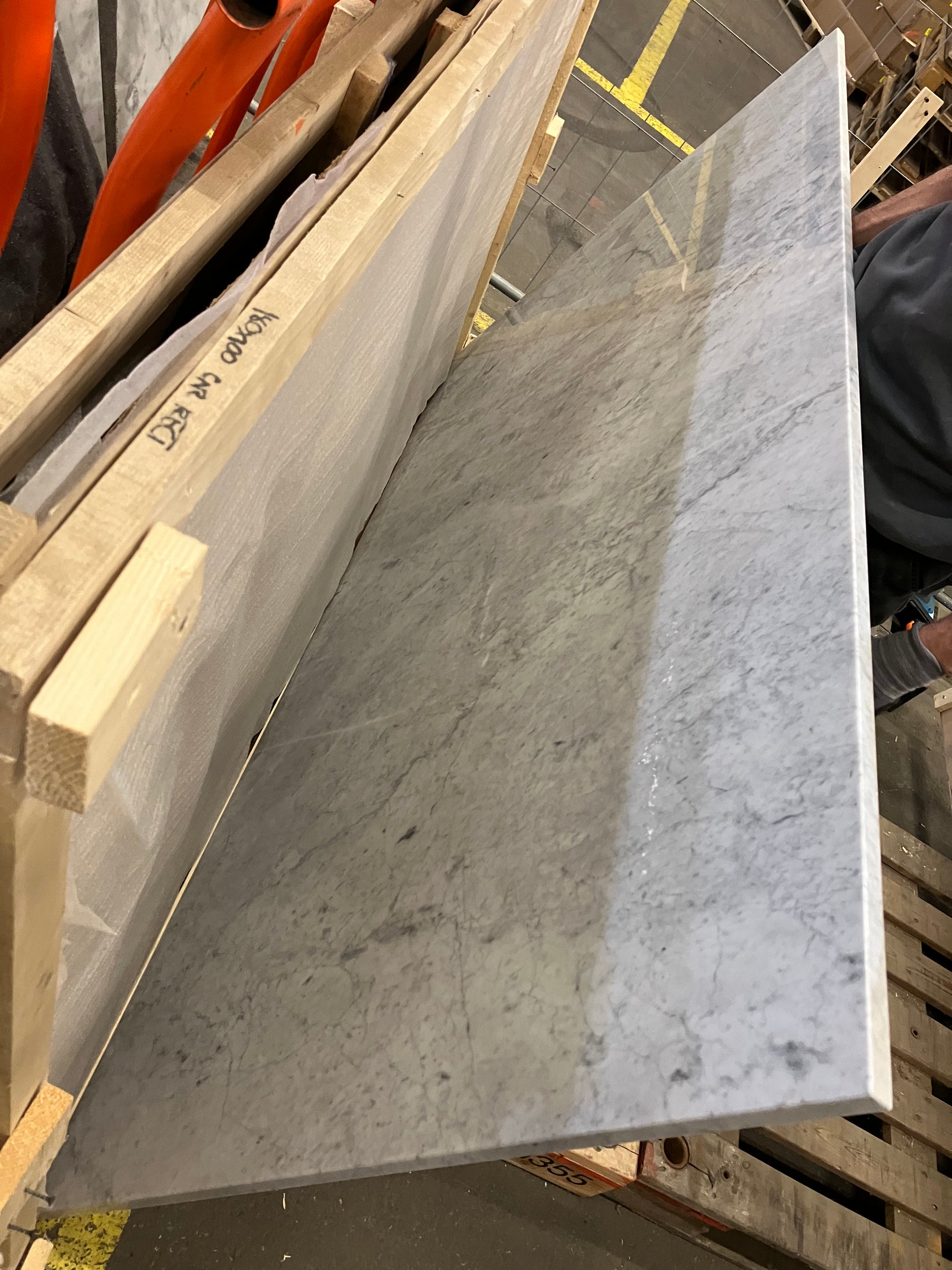 Rectangular Bianco Carrara White marble dining table with four legs, matte finish, light streaks and spots, 180x100 cm.