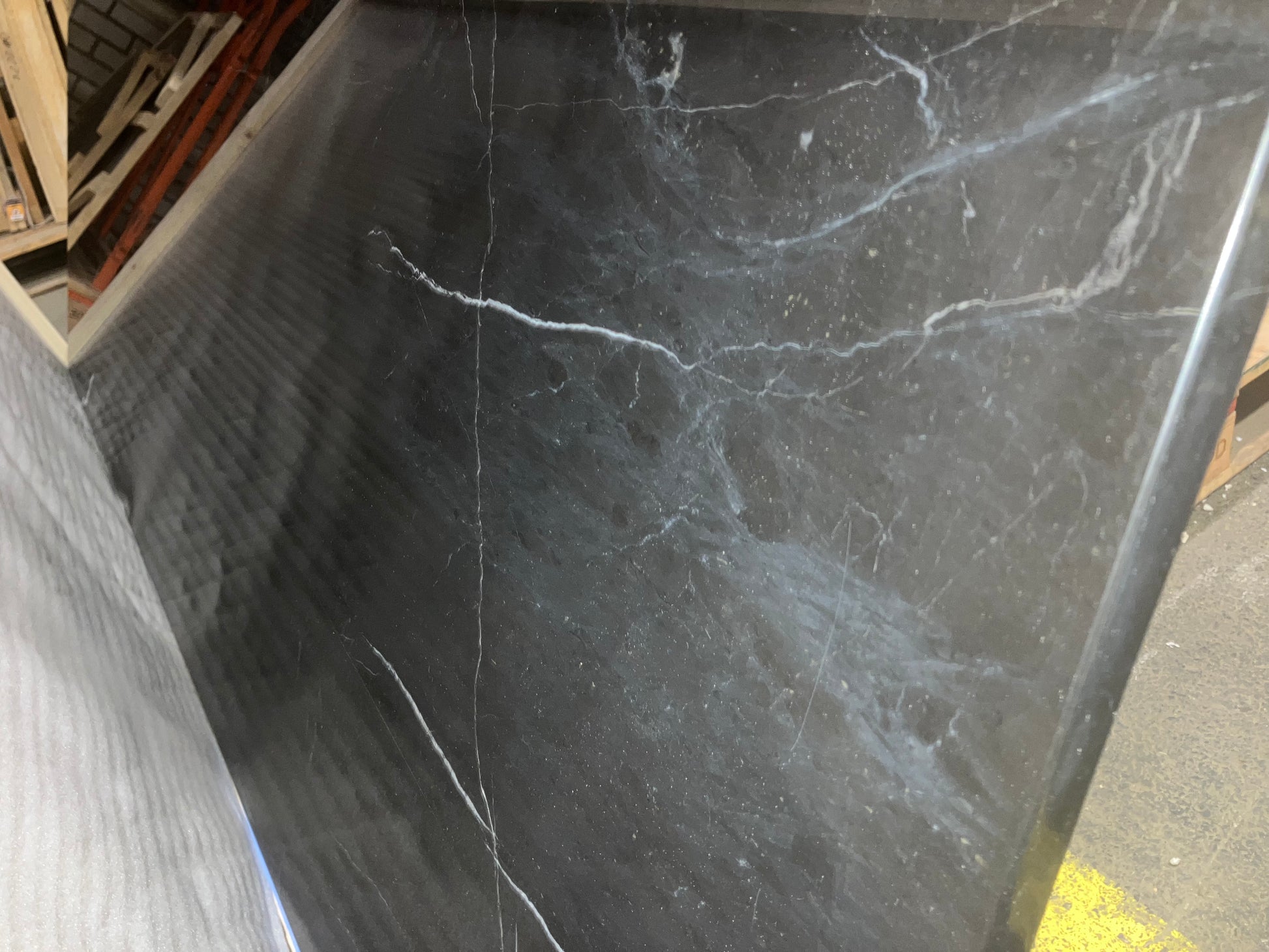 Rectangular Nero Marquina black marble dining table with matte finish and U-frame design, measuring 180x80 cm.