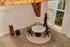 Flow oval dining table by My Store with dark Emperador marble top and black cylindrical base, glossy finish, 180x90 cm.