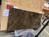 Rectangular marble dining table in dark Emperador brown with four legs, matte finish, light scratches, measuring 180x90 cm.