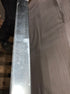 Rectangular Nero Marquina marble dining table with U-frame, matte finish, showing light scratches and damaged edges.