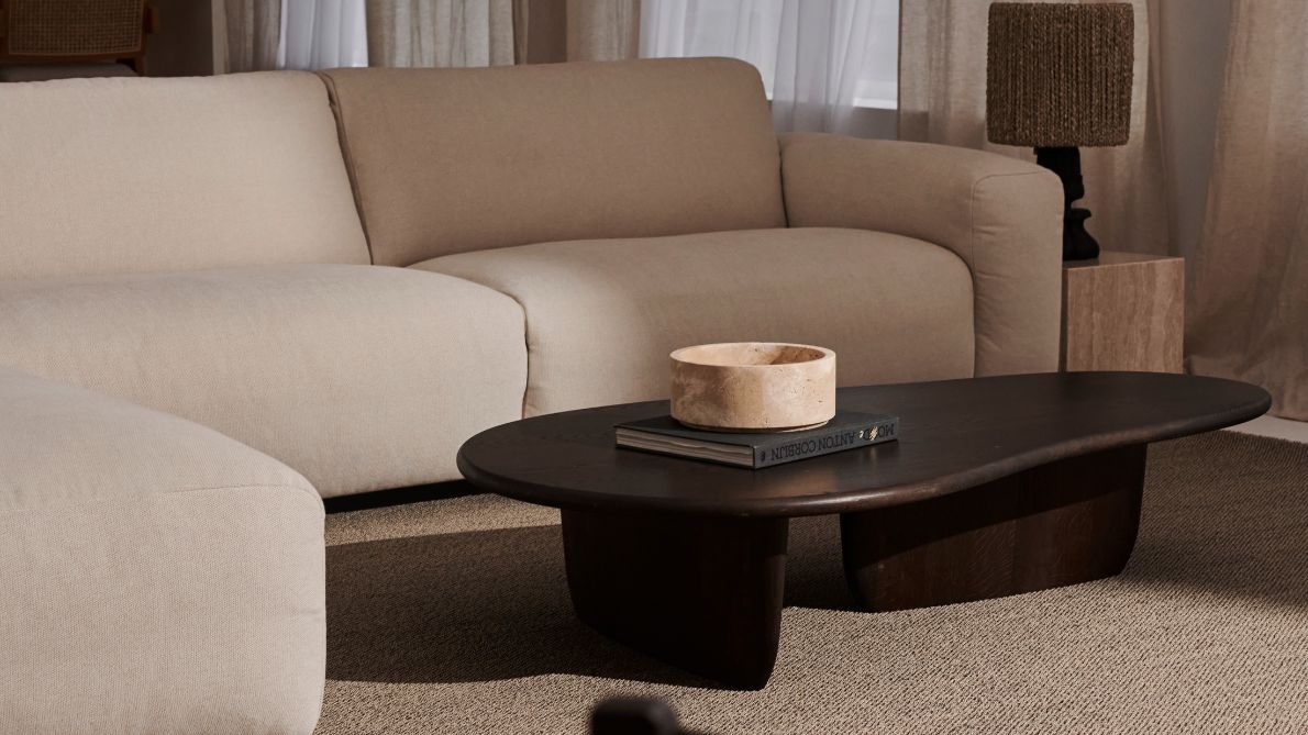 Right corner view of the NOLLIE Teddy 98 Ivory sofa, a plush, modern corner sofa in soft ivory fabric.