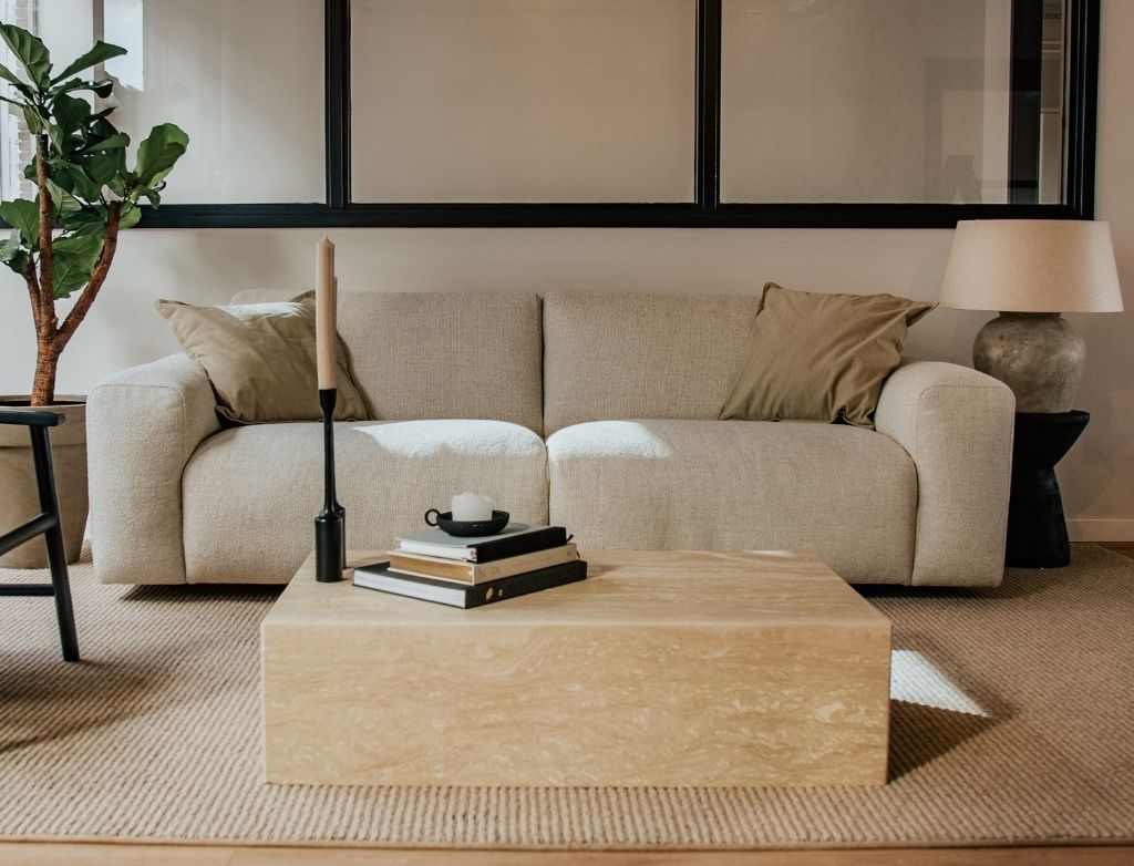 Two-seater NOLLIE Monza 00 Ivory sofa by My Store, featuring plush upholstery and modern design in a cozy living room setting.