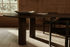 Organic dining table by My Store, FRANKY model in smoked oak OUD finish, showcasing the sleek wooden surface and sturdy design.
