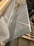 Rectangular Bianco Carrara white marble dining table with four legs, matte finish, featuring gray tones and glue residue visible.