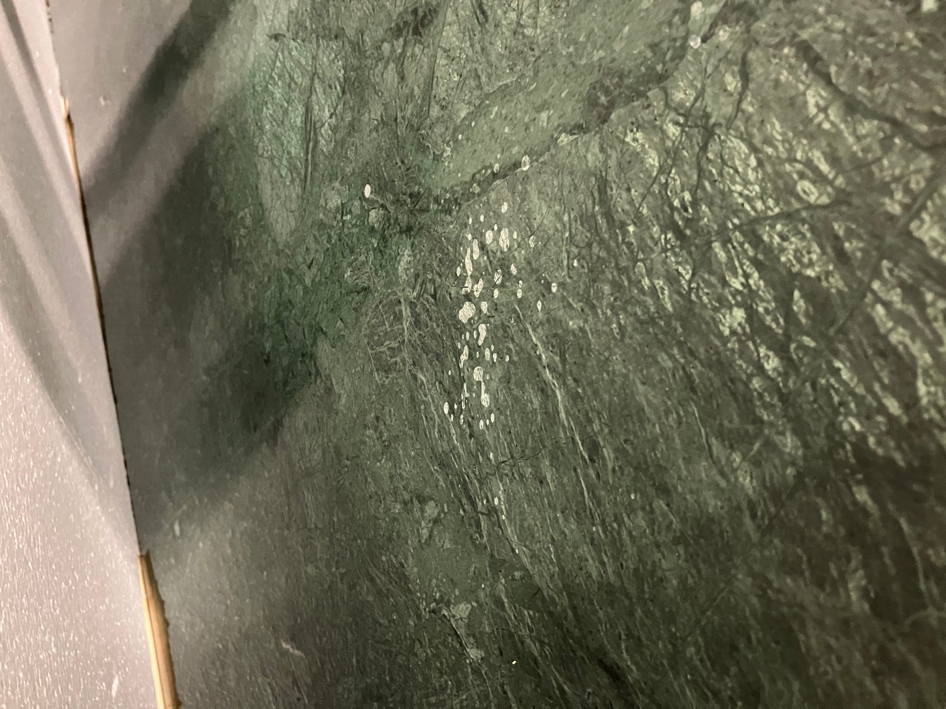 Rectangular India Green marble dining table with U-frame, 200x80 cm, matte finish, minor splatter marks, in excellent condition.