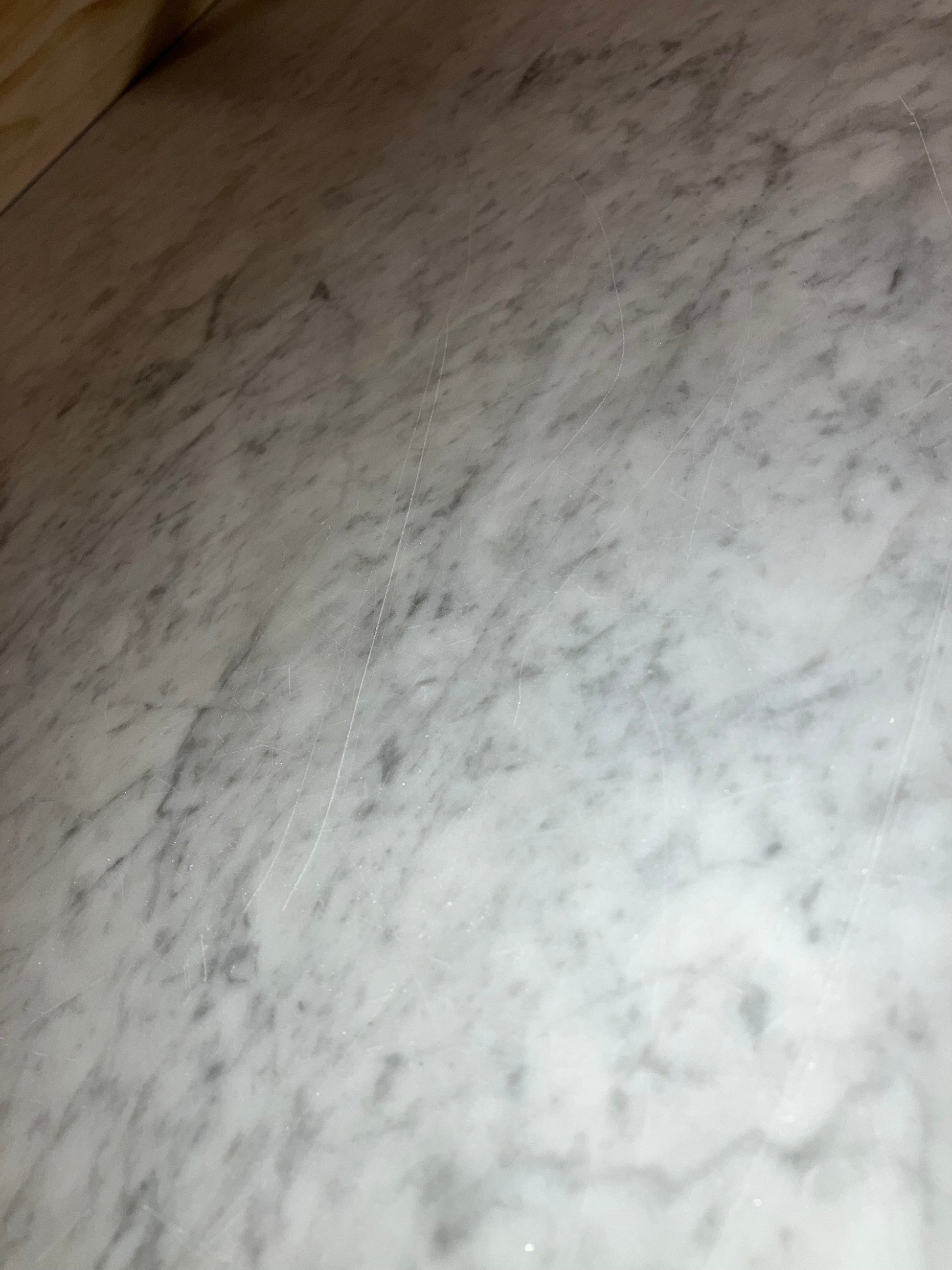 Rectangular marble dining table with four legs in Bianco Carrara white, matte finish, small scratches, 200x80 cm size.