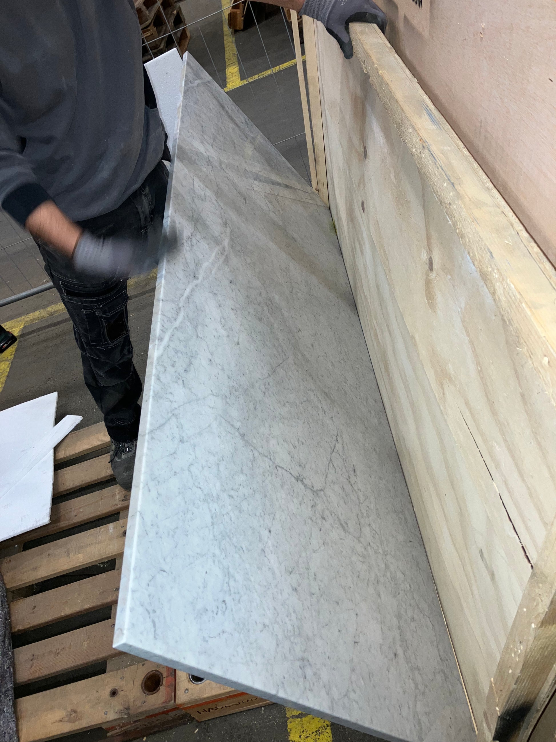 Rectangular Bianco Carrara White marble dining table with four legs, matte finish, small scratches, 200x80 cm.