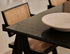 Rectangular Nero Marquina black marble dining table with U-frame from My Store, showing matte finish with small dents and stains.