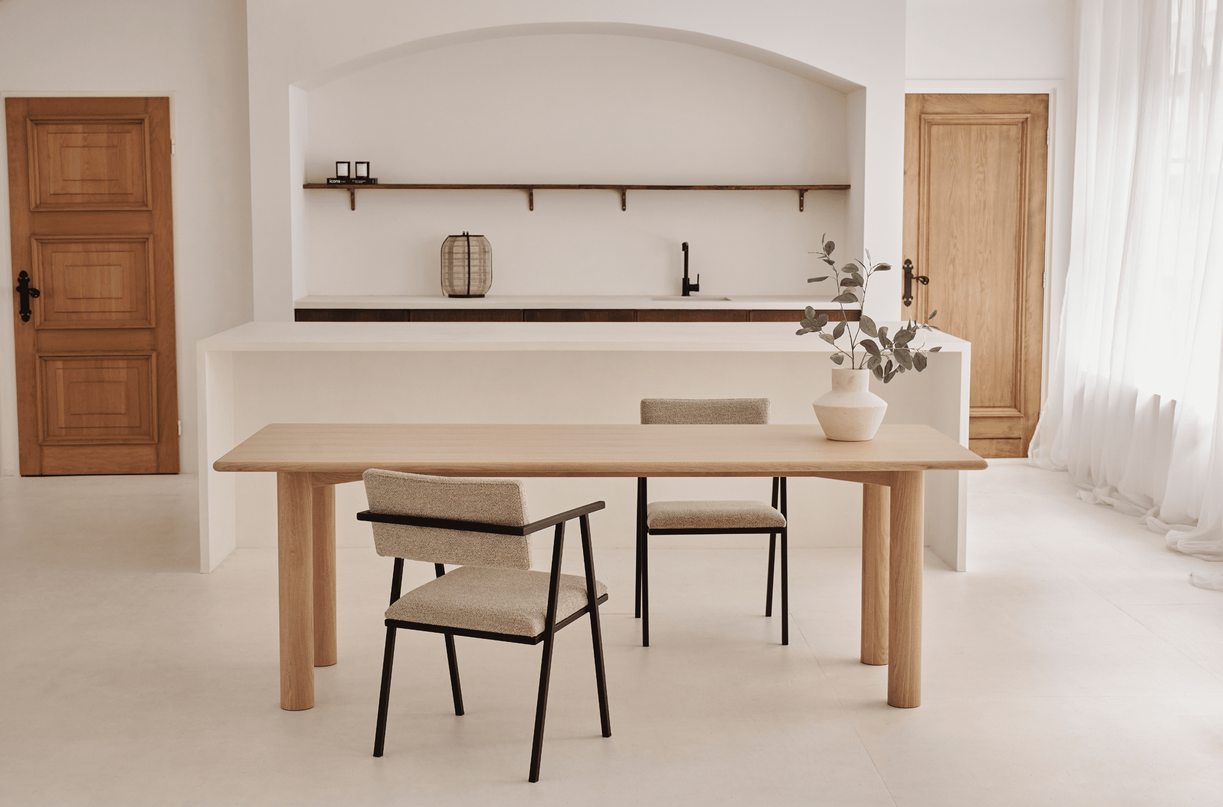 Rectangular dining table in natural oak with a sleek, minimalist design, perfect for modern dining rooms.