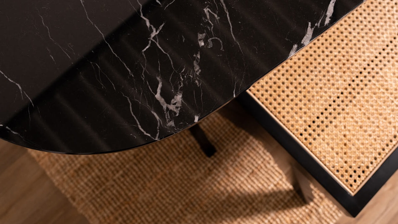 Celio Marble Dining Table by My Store with Nero Marquina black marble top and V-frame, showing glossy finish with minor stains and scratches.