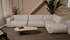 Silver YUTO Sofa Capucine longchair left in a modern living room, featuring plush cushions and sleek design.