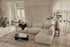 Dark grey YUTO sofa Phoebe longchair left in a modern living room setting, showcasing its spacious design and plush upholstery.