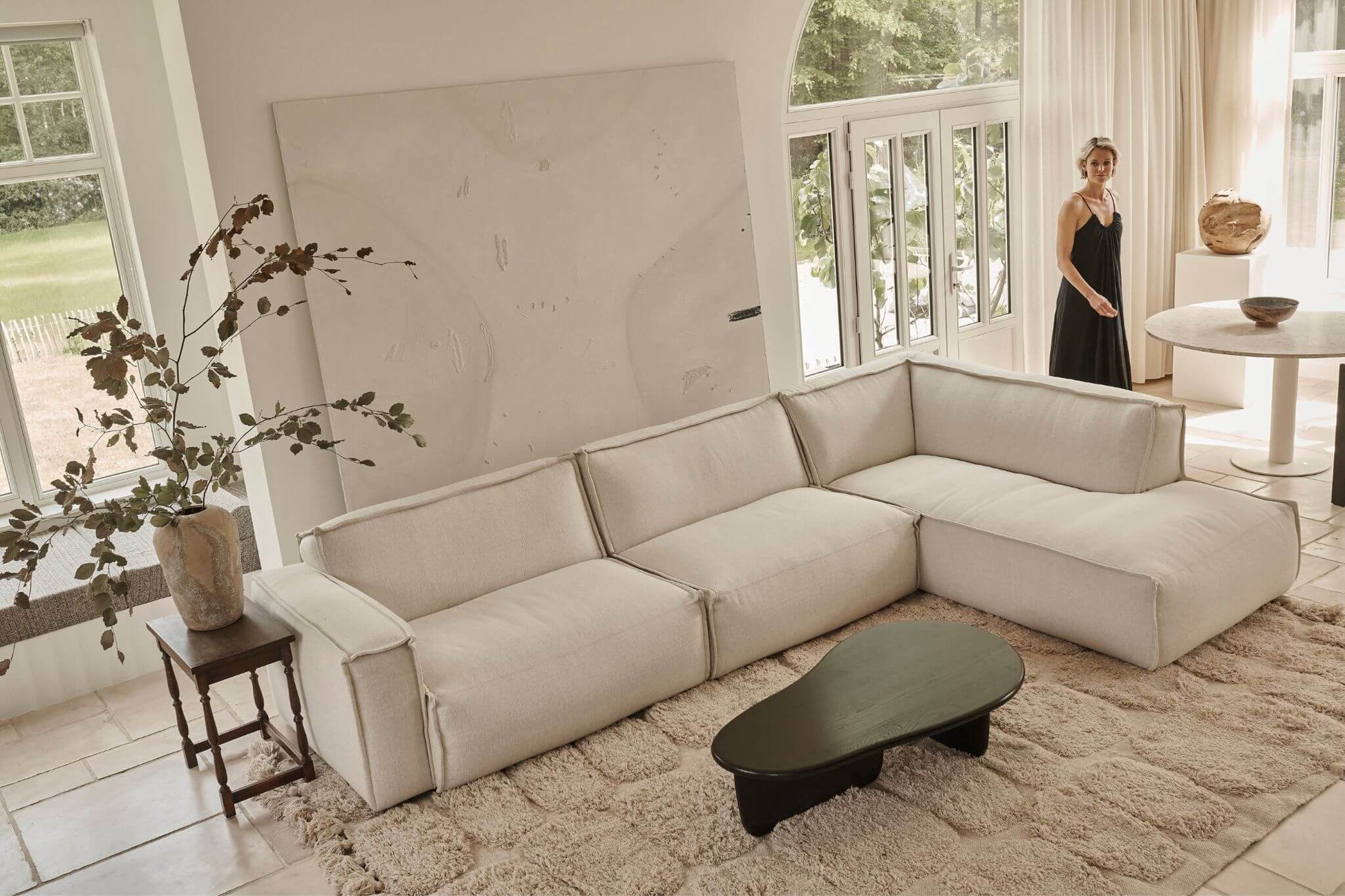 Off-white YUTO 3-seater sofa by My Store with plush fabric and modern design, shown in a cozy living room setting.