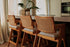 Upholstered off-white Pierre barstool with dark brown legs, 65 cm height, modern design, suitable for kitchen or bar area.