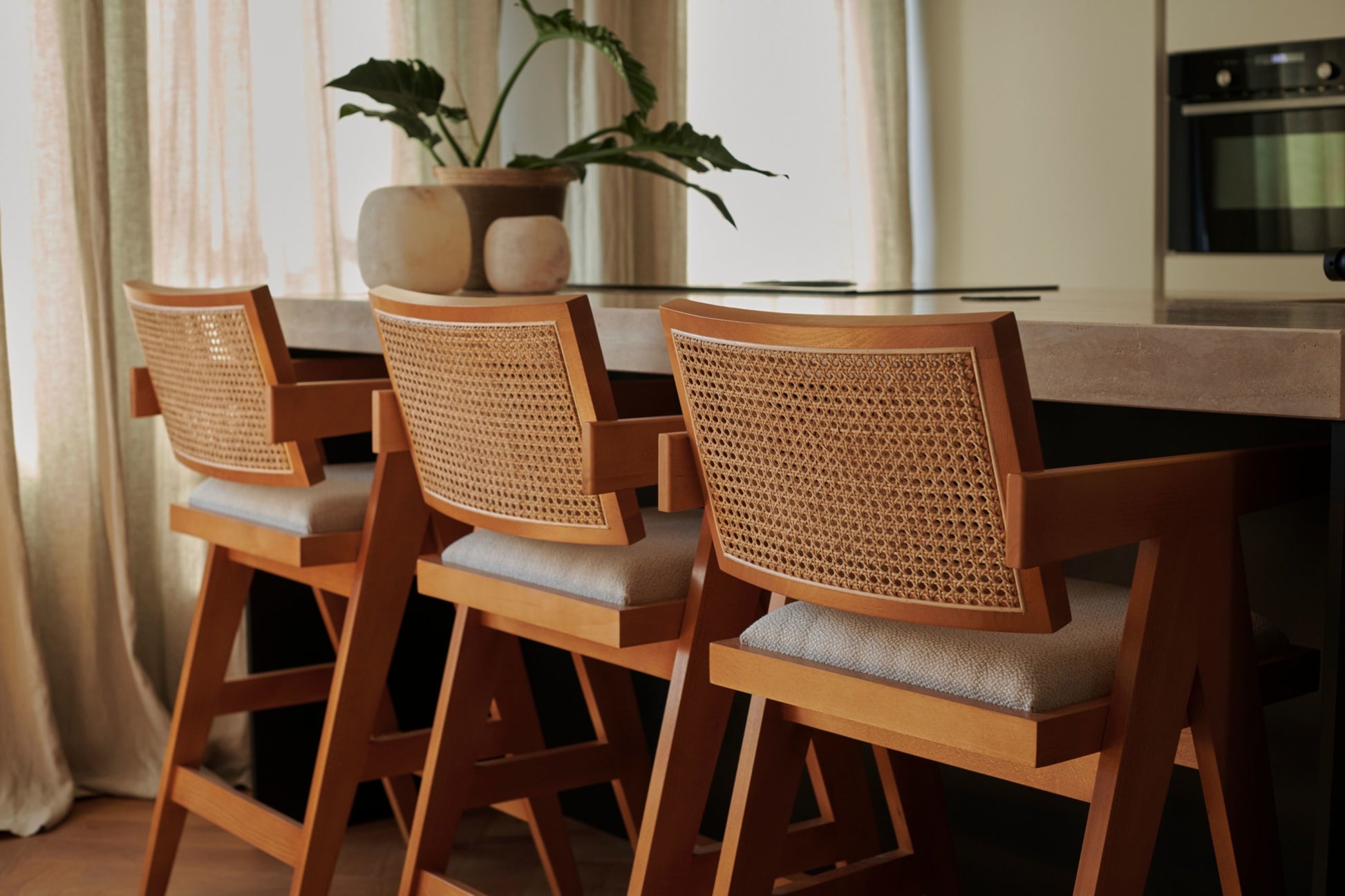 Upholstered off-white Pierre barstool with dark brown legs, 65 cm height, modern design, suitable for kitchen or bar area.
