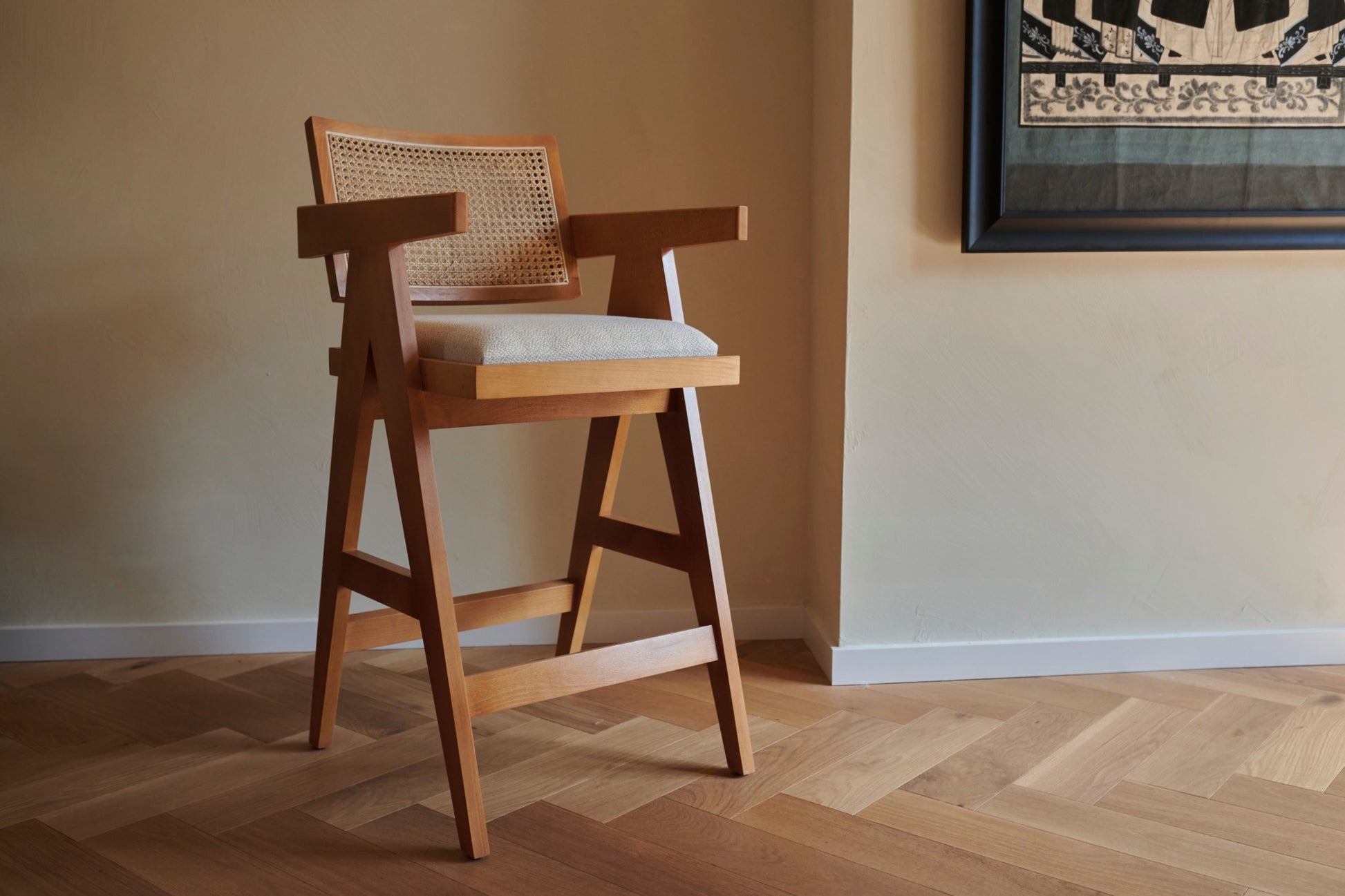 Upholstered off-white Pierre barstool with dark brown wooden legs, 65cm height, modern design for kitchen or bar area.